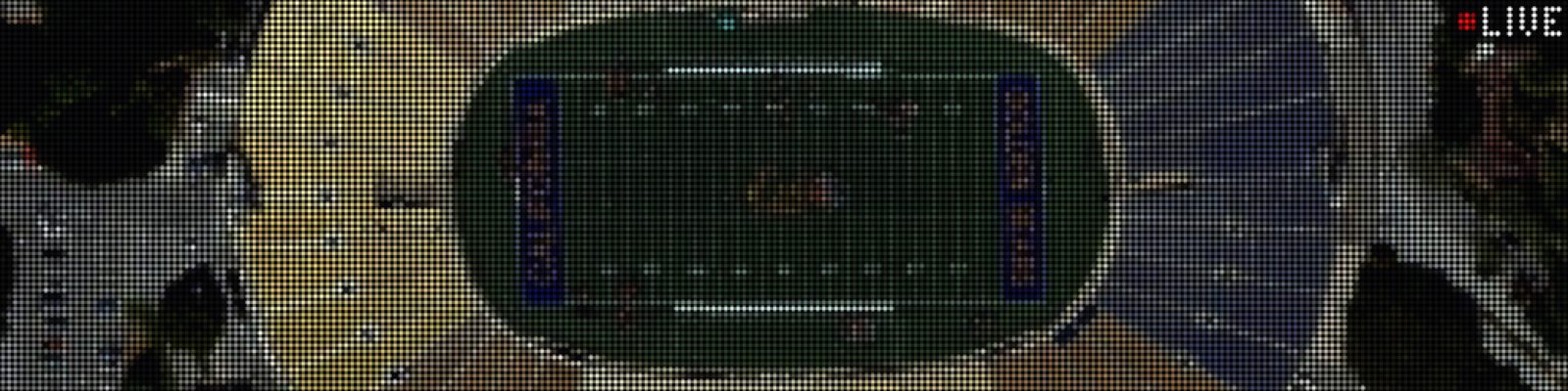 Board display showing a live stadium camera view